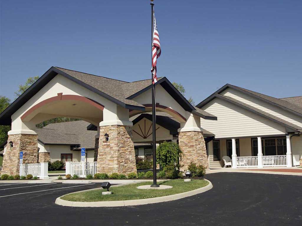 FAIRHOPE Hospice building entrance with flagpole