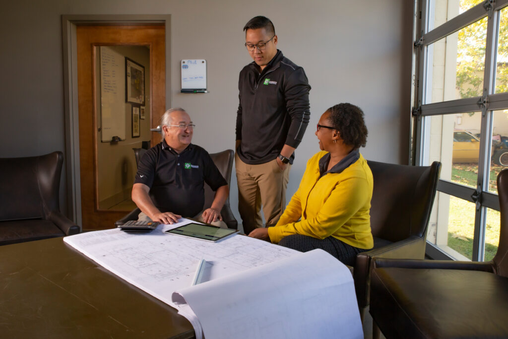 Gorsuch construction team looking at blueprints
